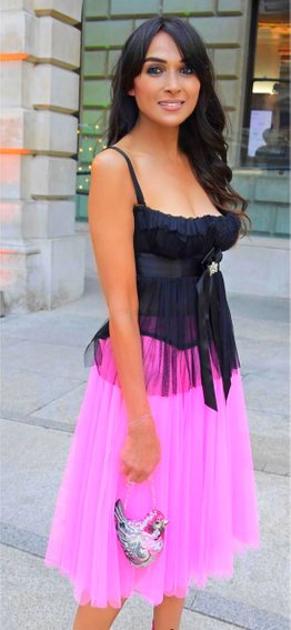 Jackie St Clair Wearing a pink and black gypsy inspired dress and corset top